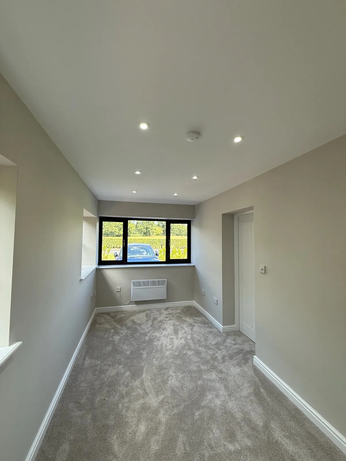 A finished garage conversion ready for furniture, completed by the Convert Your Garage team.